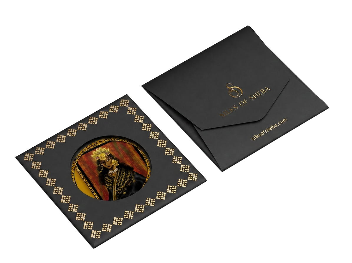 Silks of Sheba luxury packaging envelope with gold foil branding on transparent background