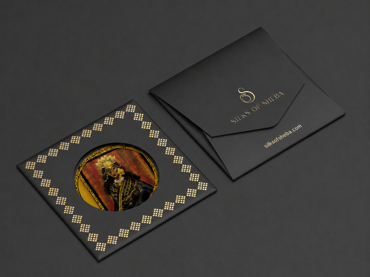 Silks of Sheba black envelope with gold foil logo and Tibeb-patterned scarf card